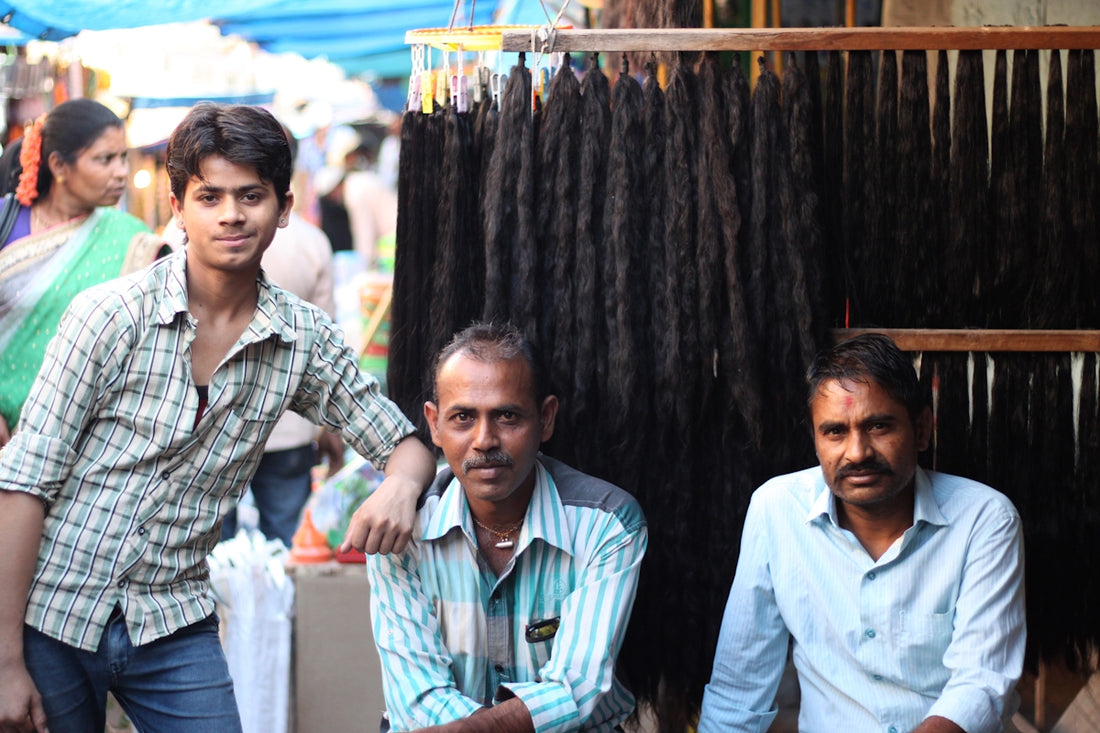 A group of men sitting next to each other